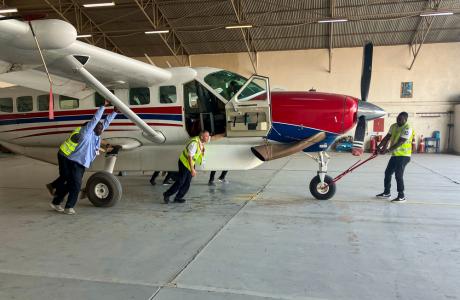Team taking the aircraft by hand